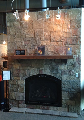 Floor to ceiling stone veneer fireplace installation Waukesha