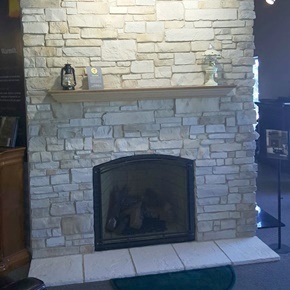 Dutch Quality stone veneer fireplace surround in our Waukesha fireplace showroom