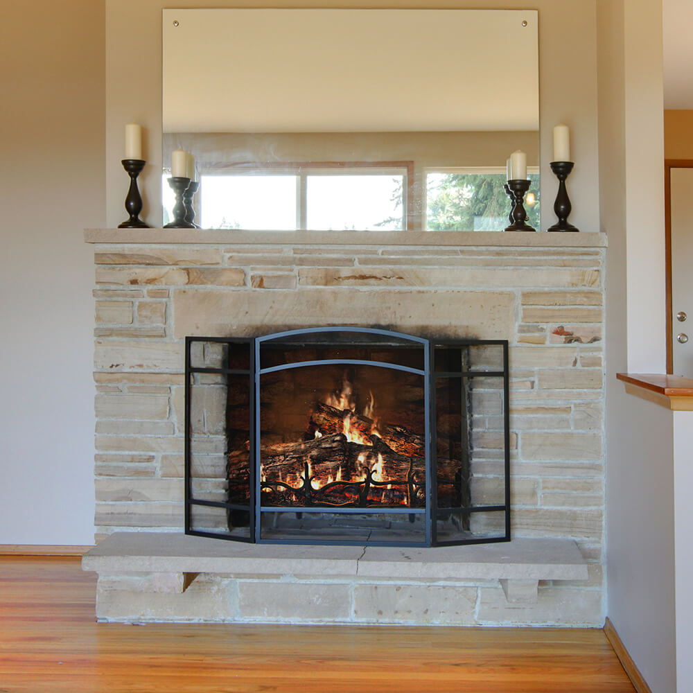 lit stone fireplace with handles on top