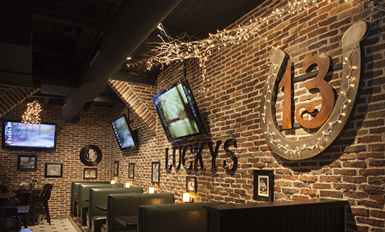 StoneBrick veneer installation on interior wall of bar.